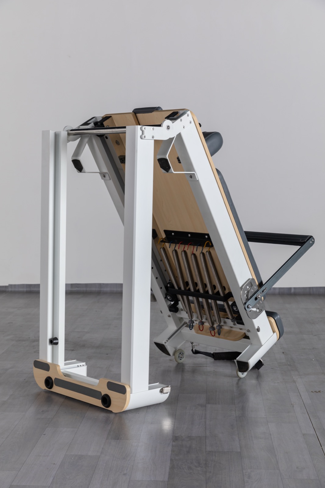Space-saving aluminum folding Pilates reformer equipment for compact studio storage view 2