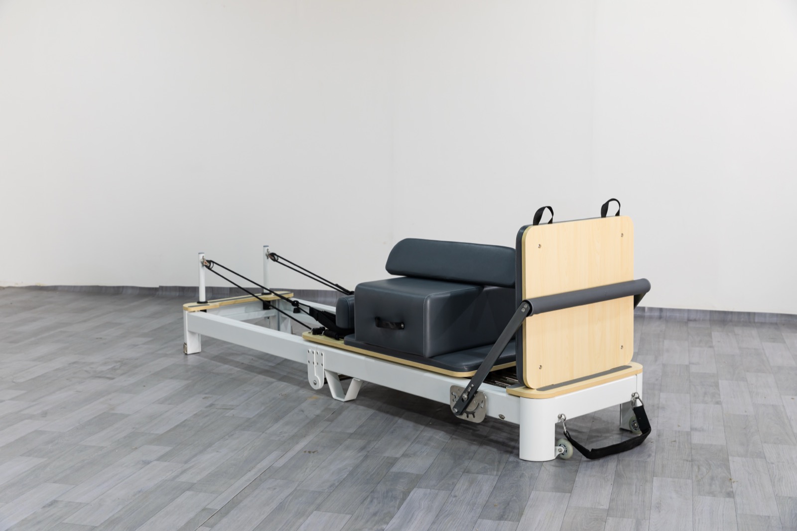 Space-saving aluminum folding Pilates reformer equipment for compact studio storage view 3